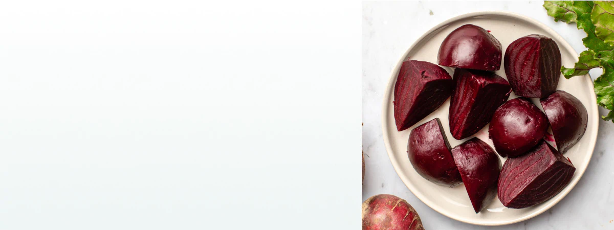 Freshly cooked and peeled beets cut into chunks on a plate, a natural ingredient found in supplements for liver health.