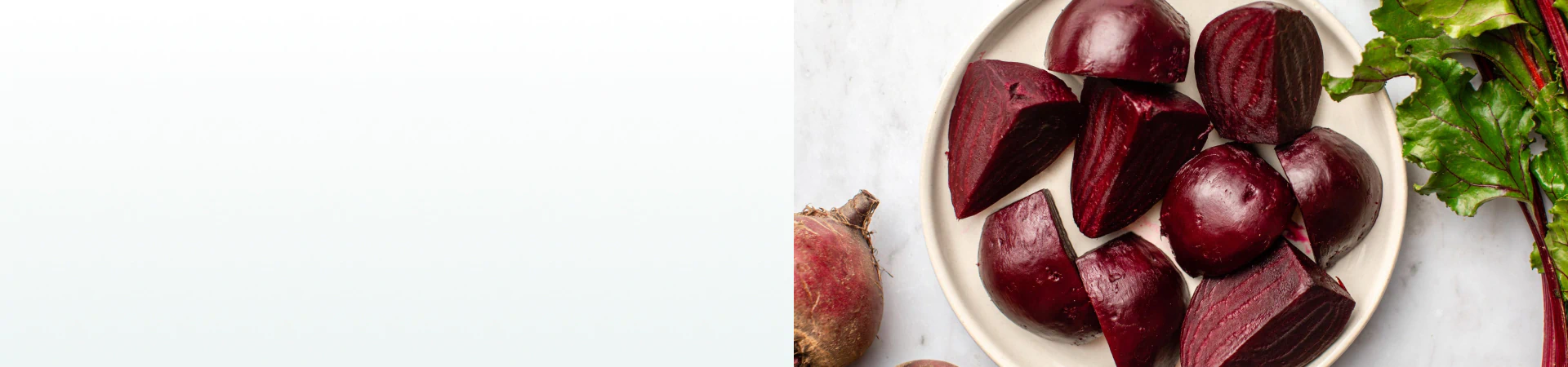Freshly cooked and peeled beets cut into chunks on a plate, a natural ingredient found in supplements for liver health.
