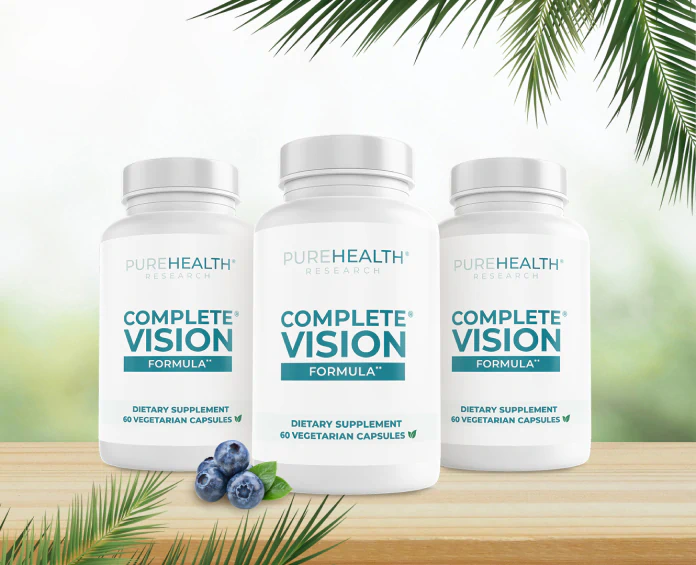 Three bottles of PureHealth Research Complete Vision Formula with fresh blueberries, showcasing the best supplements for vision.