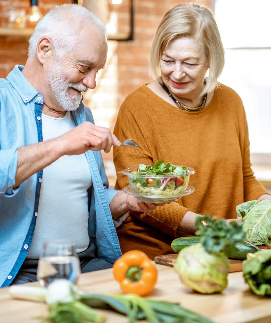 Couple making a salad