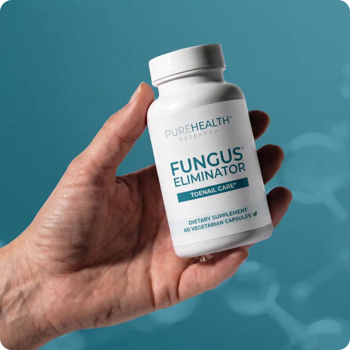 Hand holding Fungus Eliminator bottle